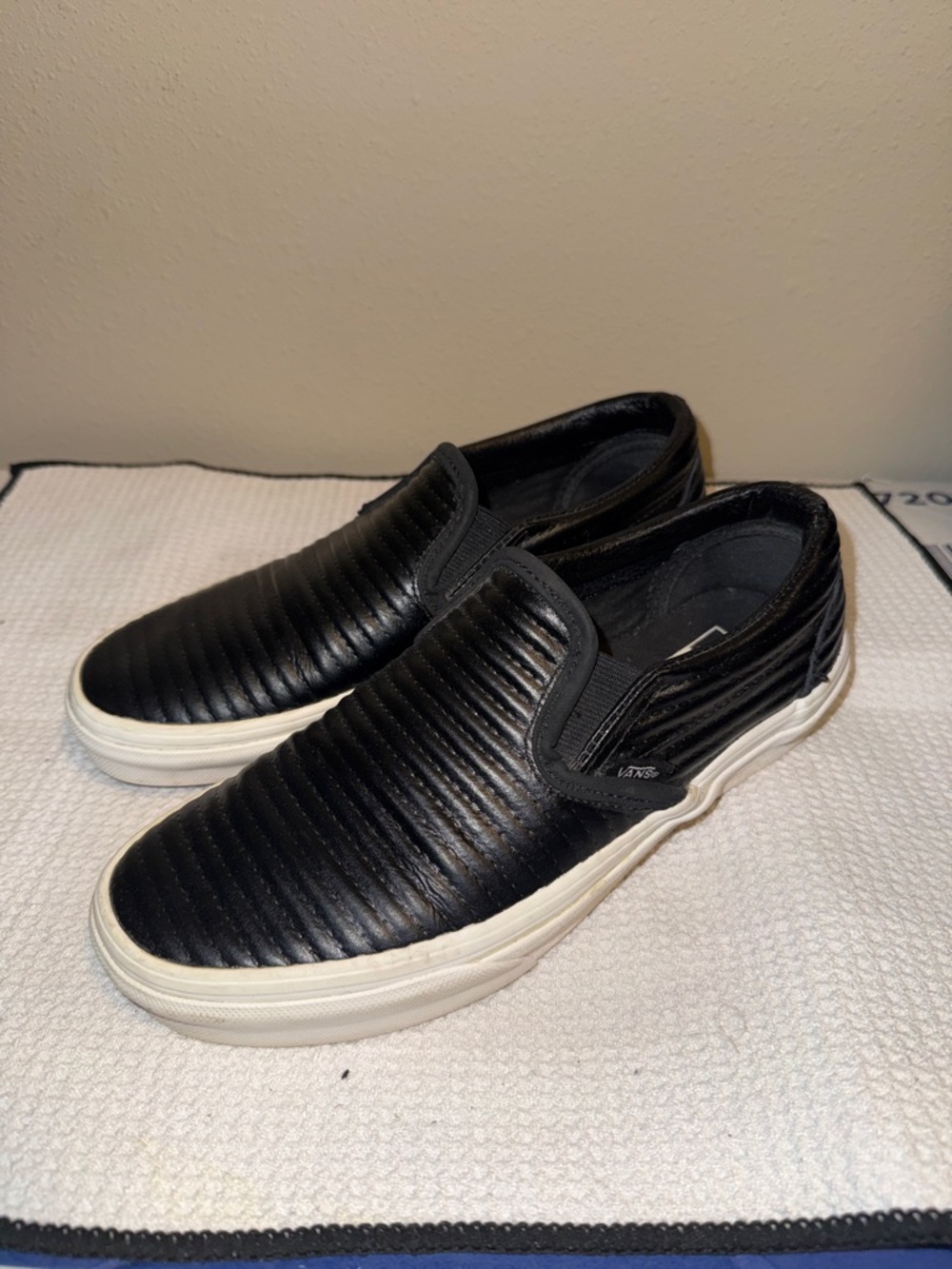 Vans Unisex Black Quilted Slip-On Sneakers with White Sole